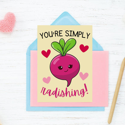 Printable Valentine’s Day Greeting Card featuring the phrase “You’re Simply Radishing” with a cute radish design. Designed as a 5x7 PDF on an 8.5 x 11 sheet with two cards per page. A fun and punny Valentine’s card for loved ones.