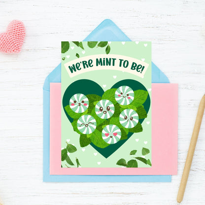 Printable Valentine’s Day card featuring the phrase “We’re Mint to Be” with a fun and fresh mint design. Designed as a 5x7 PDF on an 8.5 x 11 sheet with two cards per page. A punny and refreshing Valentine’s card for loved ones.