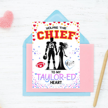 Printable Valentine’s Day card featuring the phrase “You’re the Chief to My Taylored Heart” inspired by Taylor Swift and Travis Kelce. Designed as a 5x7 PDF on an 8.5 x 11 sheet with two cards per page. Perfect for Swifties and football fans!