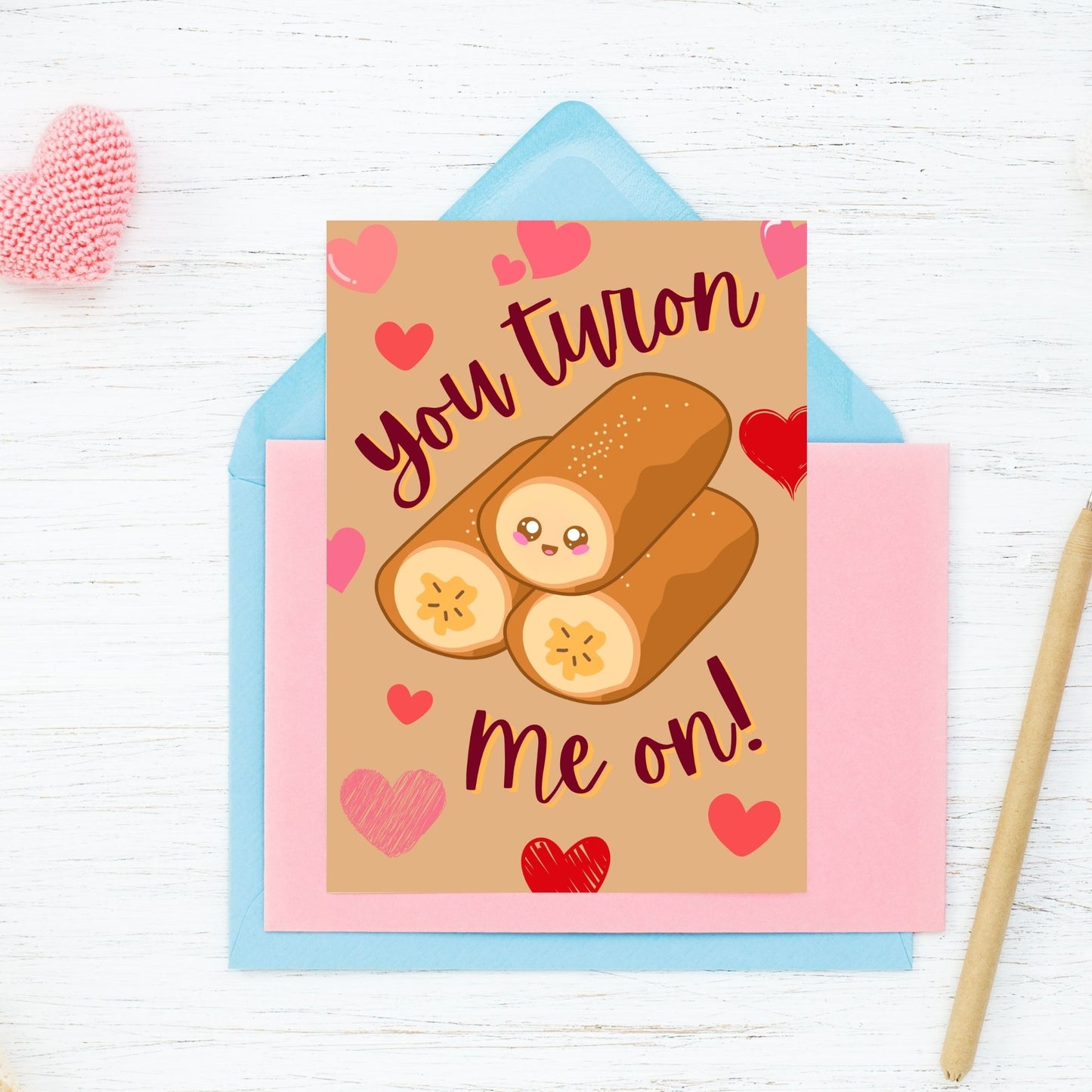 Printable Valentine’s Day card featuring the phrase “You Turon Me On” with an illustration of the Filipino dessert turon. Designed as a 5x7 PDF on an 8.5 x 11 sheet with two cards per page. A punny and culturally inspired Valentine’s card for food lovers.