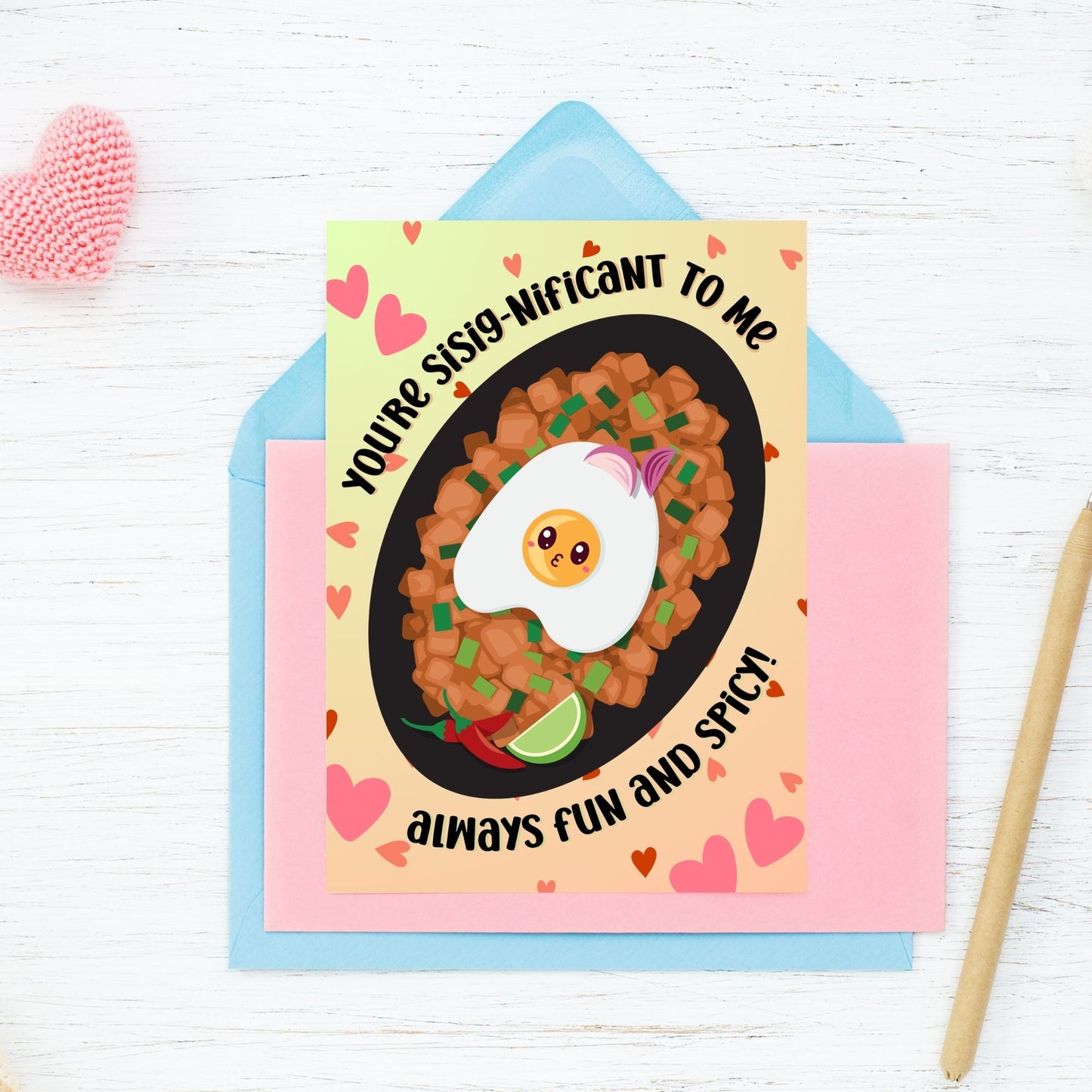 Printable Valentine’s Day card featuring the phrase “You're SiSignificant to Me” with a Filipino Sisig-inspired design. Designed as a 5x7 PDF on an 8.5 x 11 sheet with two cards per page. A punny and heartfelt Valentine’s card for Filipino food lovers.