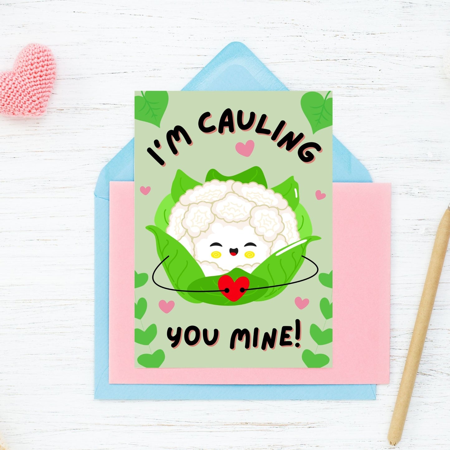 Printable Valentine’s Day Greeting Card featuring the phrase “I’m Cauling You Mine” with a cute cauliflower design. Designed as a 5x7 PDF on an 8.5 x 11 sheet with two cards per page. A fun and punny Valentine’s card for loved ones.