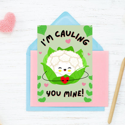 Printable Valentine’s Day Greeting Card featuring the phrase “I’m Cauling You Mine” with a cute cauliflower design. Designed as a 5x7 PDF on an 8.5 x 11 sheet with two cards per page. A fun and punny Valentine’s card for loved ones.