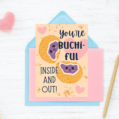 Printable Valentine’s Day card featuring the phrase “You’re Buchiful Inside and Out” with a cute and charming buchi (sticky sesame ball) design. Designed as a 5x7 PDF on an 8.5 x 11 sheet with two cards per page. A punny and heartfelt Valentine’s card for food lovers.