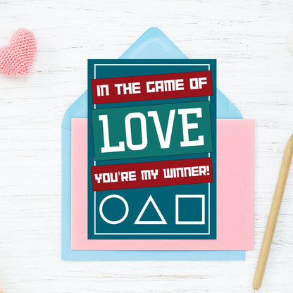A Squid Game-inspired printable Valentine's Day card featuring bold graphics and a playful love message. Perfect for fans of the show who want a fun and unique Valentine’s card.