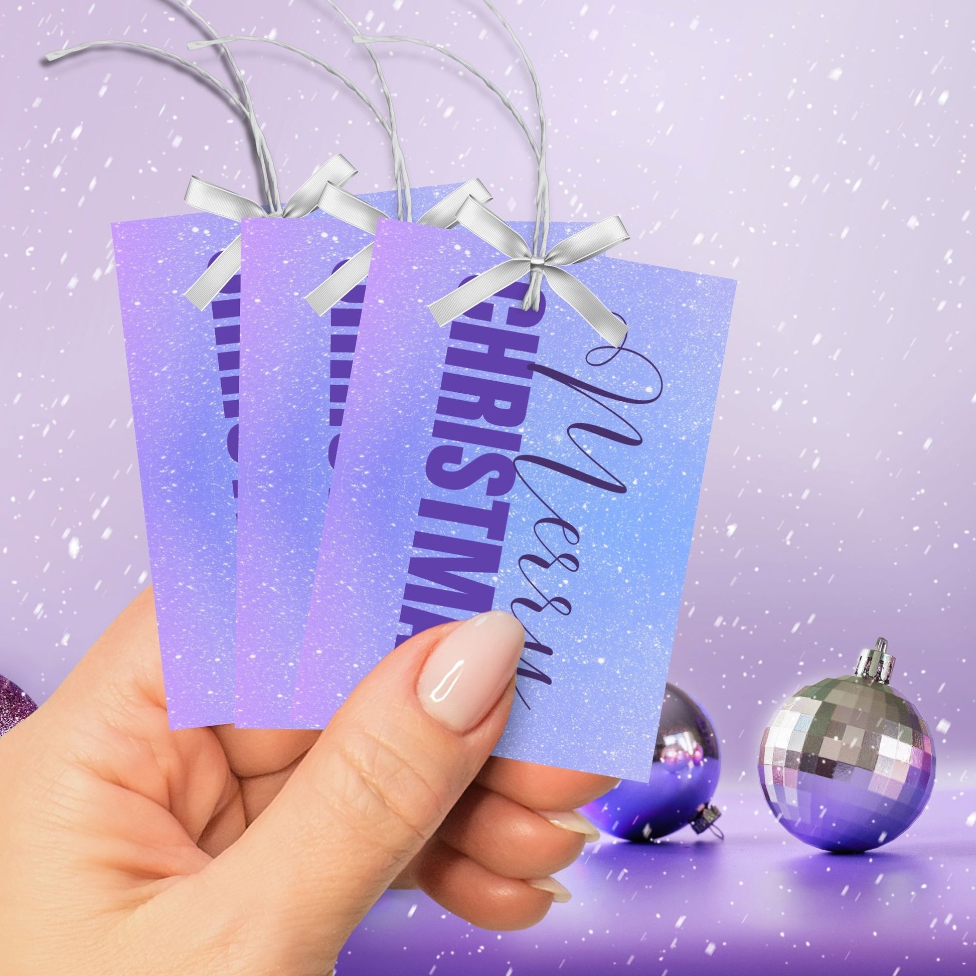 Printable Christmas gift tags featuring a lavender and sky blue gradient background with purple "Merry Christmas" text, sized 2.5 x 3.5 inches, 8 tags per sheet.