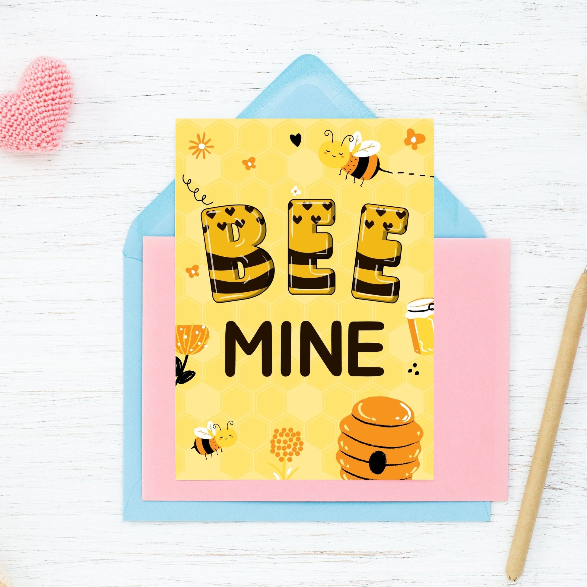 Printable Valentine’s Day Greeting Card featuring the phrase “Bee Mine.” Designed as a 5x7 PDF on an 8.5 x 11 sheet with two cards per page. A cute and charming Valentine’s card for bee lovers.