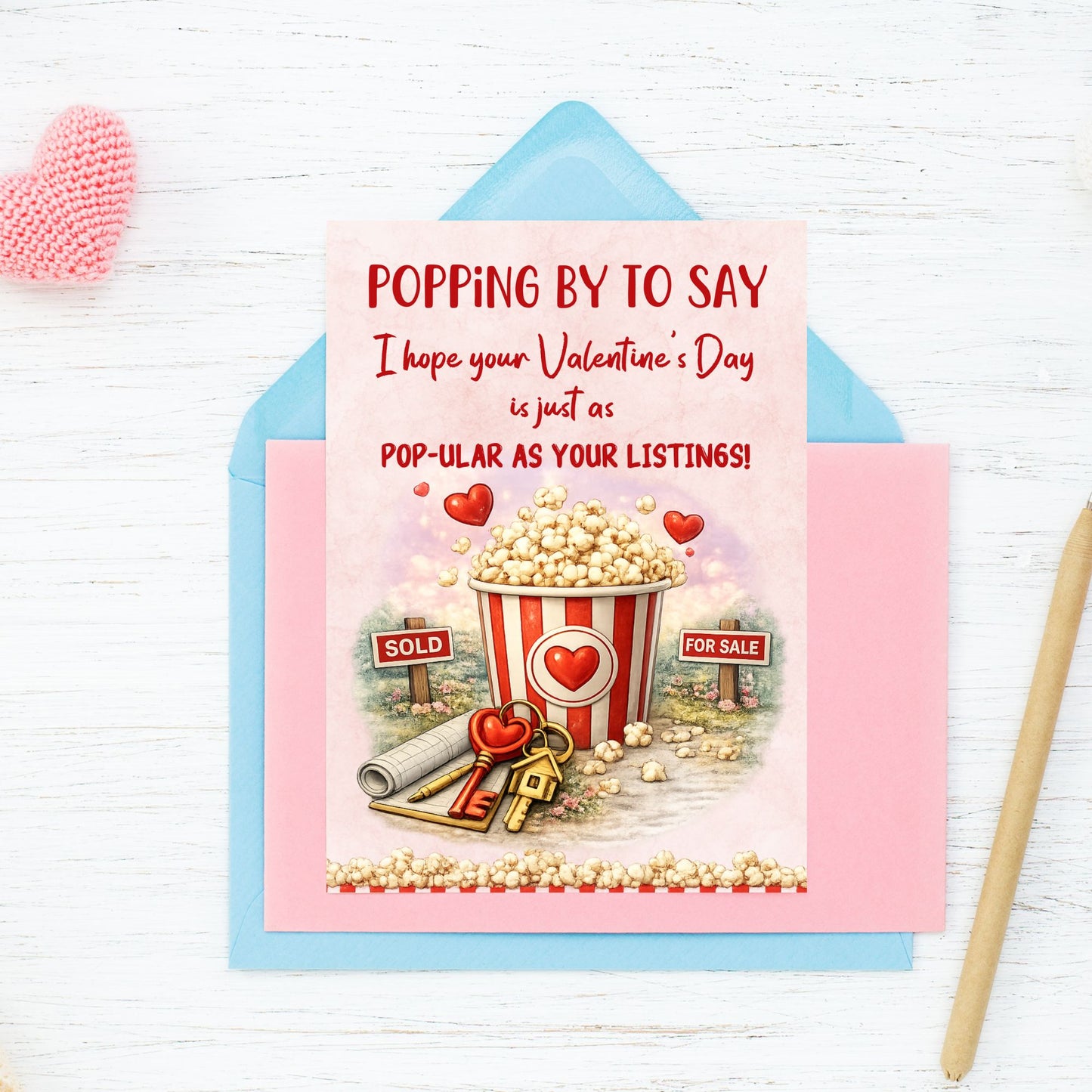 Printable popcorn Valentine’s Day card for realtors featuring a popcorn bucket, real estate signs, keys, and the phrase “Pop-ular as Your Listings,” designed as a client appreciation gift.