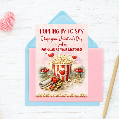 Printable popcorn Valentine’s Day card for realtors featuring a popcorn bucket, real estate signs, keys, and the phrase “Pop-ular as Your Listings,” designed as a client appreciation gift.