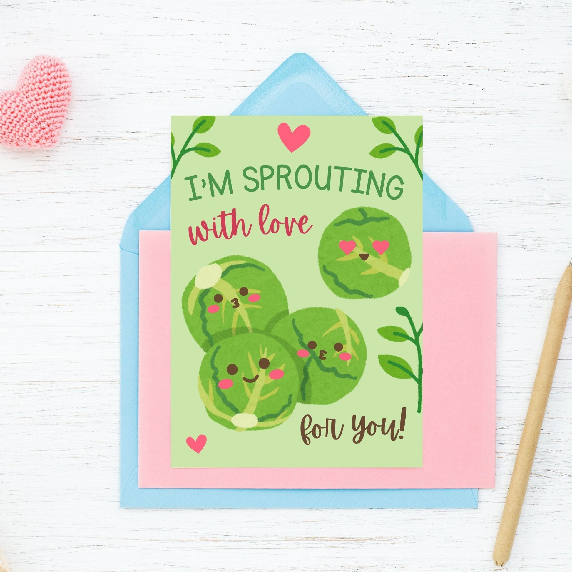 Printable Valentine’s Day Greeting Card featuring the phrase “I’m Sprouting with Love for You” with a cute brussels sprouts illustration. Designed as a 5x7 PDF on an 8.5 x 11 sheet with two cards per page. A fun and punny Valentine’s card for veggie lovers.