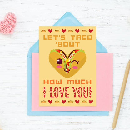 Printable Valentine’s Day Greeting Card featuring the phrase “Let’s Taco ‘Bout How Much I Love You” with a taco theme. Designed as a 5x7 PDF on an 8.5 x 11 sheet with two cards per page. A fun and punny Valentine’s card for taco enthusiasts.