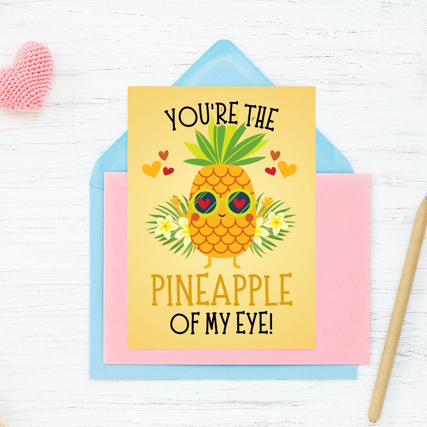 Printable Valentine’s Day Greeting Card featuring the phrase “You’re the Pineapple of My Eye” with a cheerful pineapple theme. Designed as a 5x7 PDF on an 8.5 x 11 sheet with two cards per page. A fun and tropical Valentine’s card for loved ones.