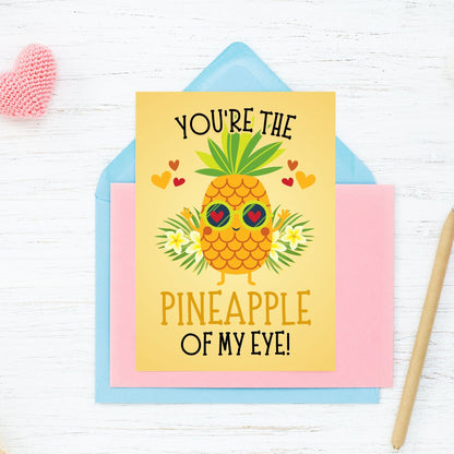 Printable Valentine’s Day Greeting Card featuring the phrase “You’re the Pineapple of My Eye” with a cheerful pineapple theme. Designed as a 5x7 PDF on an 8.5 x 11 sheet with two cards per page. A fun and tropical Valentine’s card for loved ones.