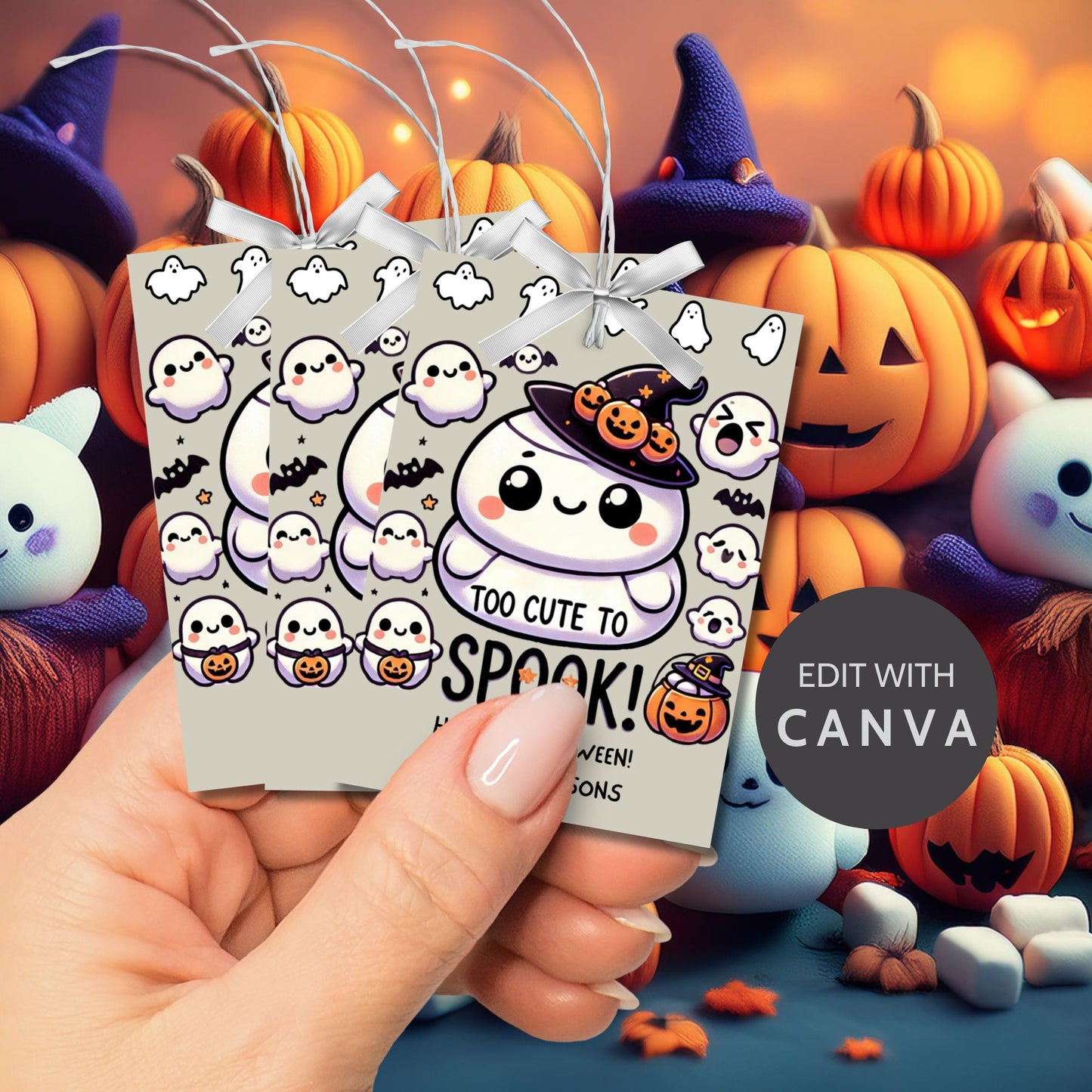 Cute Halloween gift tags featuring a squishy ghost in a witch hat, surrounded by ghosts and pumpkins. The tag reads "Too Cute to Spook!" and is perfect for Squishmallow-themed Halloween gifts. The tags are 2.5 x 3.5 inches and come with a printable PDF and an editable template.