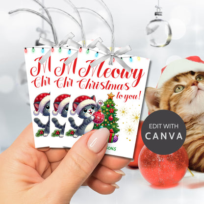 Christmas gift tags featuring a cute kitten in a Santa hat with a festive tree and gifts, paired with the message "Meowy Christmas to you!" These printable and editable tags add a playful, festive touch to holiday gifts for cat lovers.