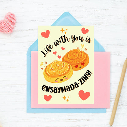 Printable Valentine’s Day card featuring the phrase “Life with You is Ensaymadazing” with a Filipino ensaymada-inspired design. Designed as a 5x7 PDF on an 8.5 x 11 sheet with two cards per page. A punny and heartfelt Valentine’s card for Filipino food lovers.