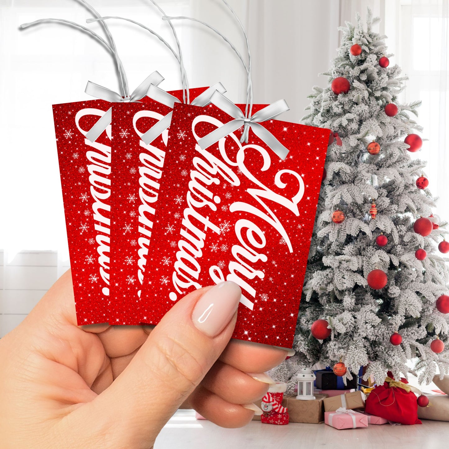 A set of red and white Christmas gift tags featuring "Merry Christmas!" in elegant white script on a sparkling red background with snowflake accents. These tags are 2.5 x 3.5 inches, perfect for adding festive charm to your holiday gifts.