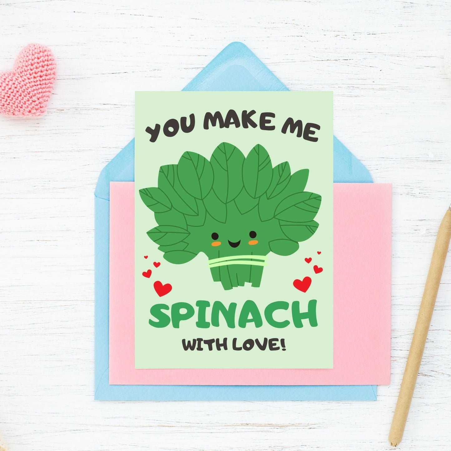 Printable Valentine’s Day Greeting Card featuring the phrase “You Make Me Spinach with Love” with a fun spinach design. Designed as a 5x7 PDF on an 8.5 x 11 sheet with two cards per page. A punny and fresh Valentine’s card for loved ones.