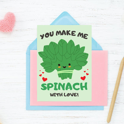 Printable Valentine’s Day Greeting Card featuring the phrase “You Make Me Spinach with Love” with a fun spinach design. Designed as a 5x7 PDF on an 8.5 x 11 sheet with two cards per page. A punny and fresh Valentine’s card for loved ones.