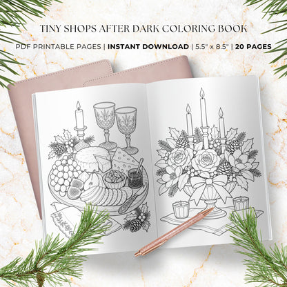 A styled flat-lay of a coloring book cover and an open preview page showing black-and-white line art of candles, grapes, wine glasses, and a floral centerpiece. Text at the top reads 'TINY SHOPS AFTER DARK COLORING BOOK' with 'PDF PRINTABLE PAGES | INSTANT DOWNLOAD | 5.