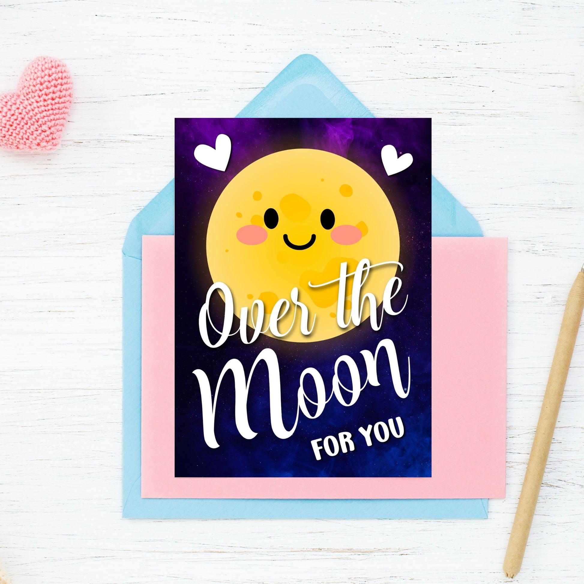 Printable Valentine’s Day Greeting Card featuring the space-inspired phrase “Over the Moon for You.” Designed as a 5x7 PDF on an 8.5 x 11 sheet with two cards per page. A romantic and heartfelt Valentine’s card for stargazers and space lovers.