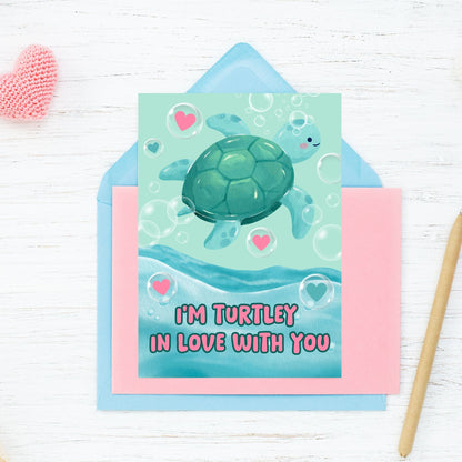 Printable Valentine’s Day Greeting Card featuring the pun “I'm Turtley in Love with You.” Designed as a 5x7 PDF on an 8.5 x 11 sheet with two cards per page. A cute and fun Valentine’s card for turtle lovers.