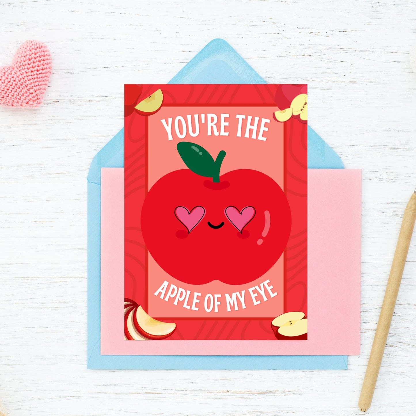 Printable Valentine’s Day Greeting Card featuring the phrase “You’re the Apple of My Eye” with an apple design. Designed as a 5x7 PDF on an 8.5 x 11 sheet with two cards per page. A sweet and timeless Valentine’s card for loved ones.