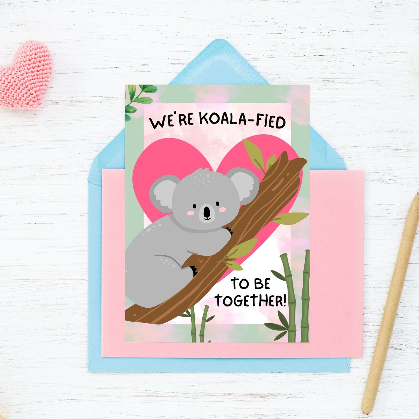 Printable Valentine’s Day Greeting Card featuring the phrase “We’re Koalafied to Be Together” with a koala design. Designed as a 5x7 PDF on an 8.5 x 11 sheet with two cards per page. A cute and punny Valentine’s card for loved ones.