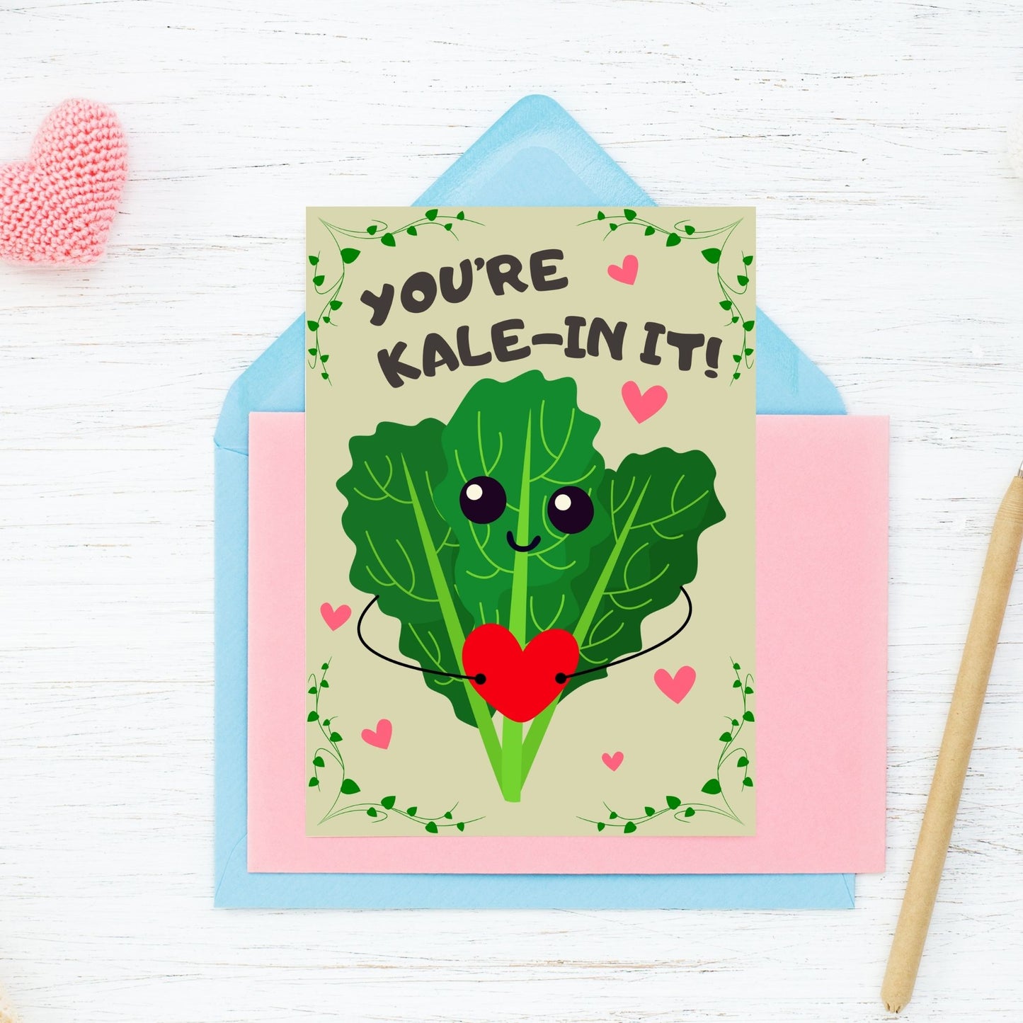 Printable Valentine’s Day Greeting Card featuring the phrase “You’re Kalein’ It” with a cute kale illustration. Designed as a 5x7 PDF on an 8.5 x 11 sheet with two cards per page. A punny and fresh Valentine’s card for loved ones.