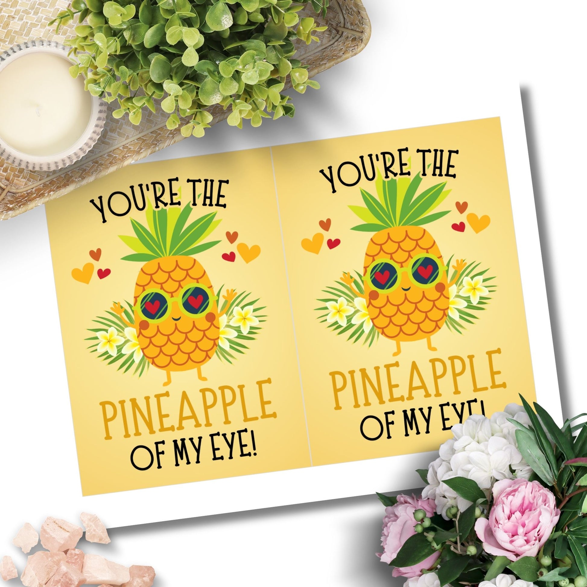 Printable Valentine’s Day Greeting Card featuring the phrase “You’re the Pineapple of My Eye” with a cheerful pineapple theme. Designed as a 5x7 PDF on an 8.5 x 11 sheet with two cards per page. A fun and tropical Valentine’s card for loved ones.