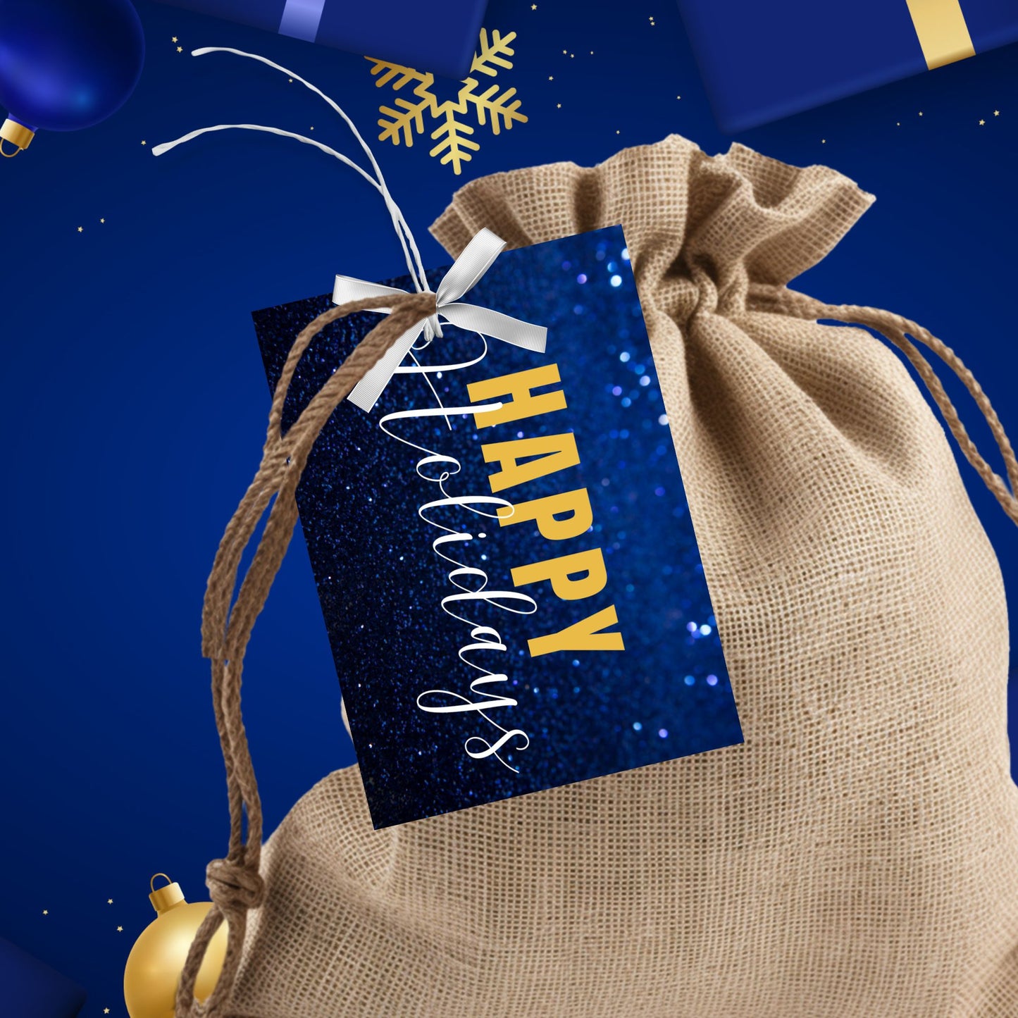 Printable blue and gold Holiday gift tags featuring a sparkling blue glitter background and bold gold "Happy Holidays" text, sized 2.5 x 3.5 inches, 8 per sheet.