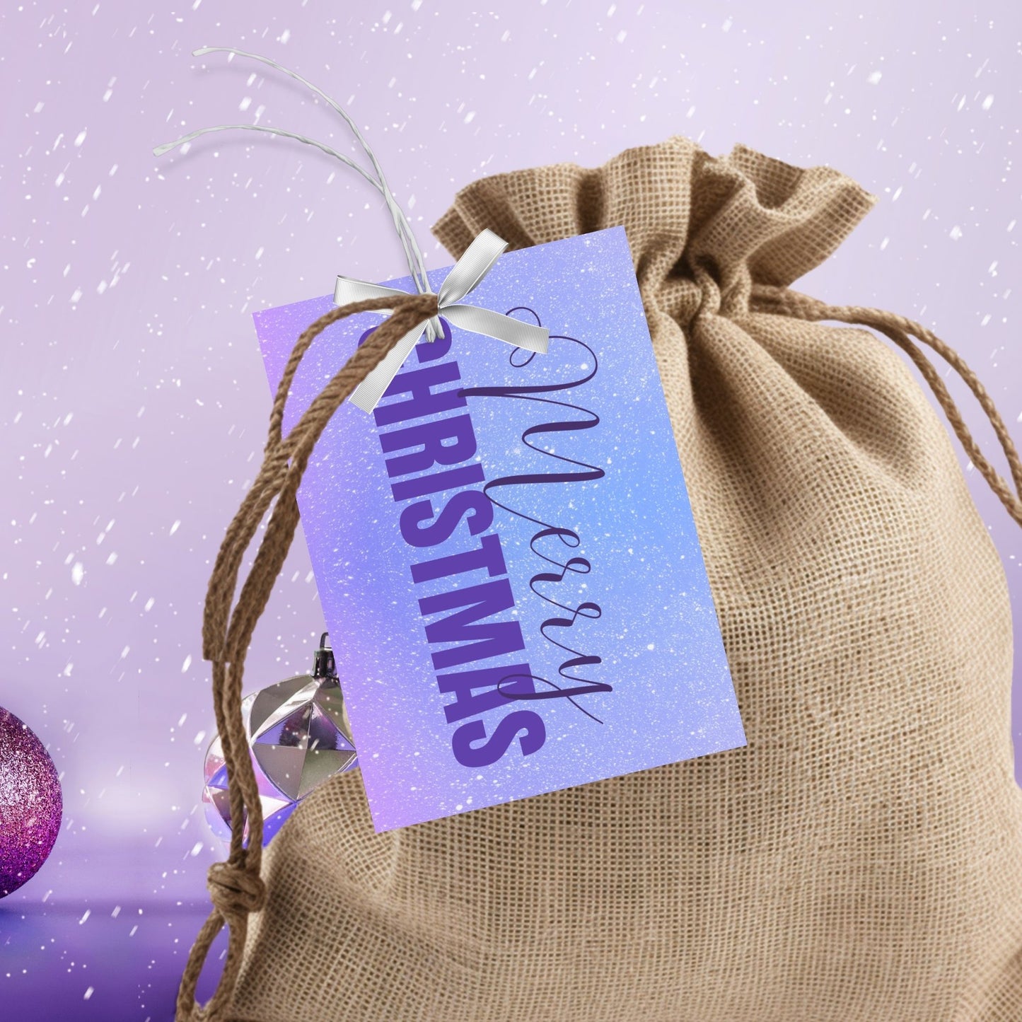 Printable Christmas gift tags featuring a lavender and sky blue gradient background with purple "Merry Christmas" text, sized 2.5 x 3.5 inches, 8 tags per sheet.