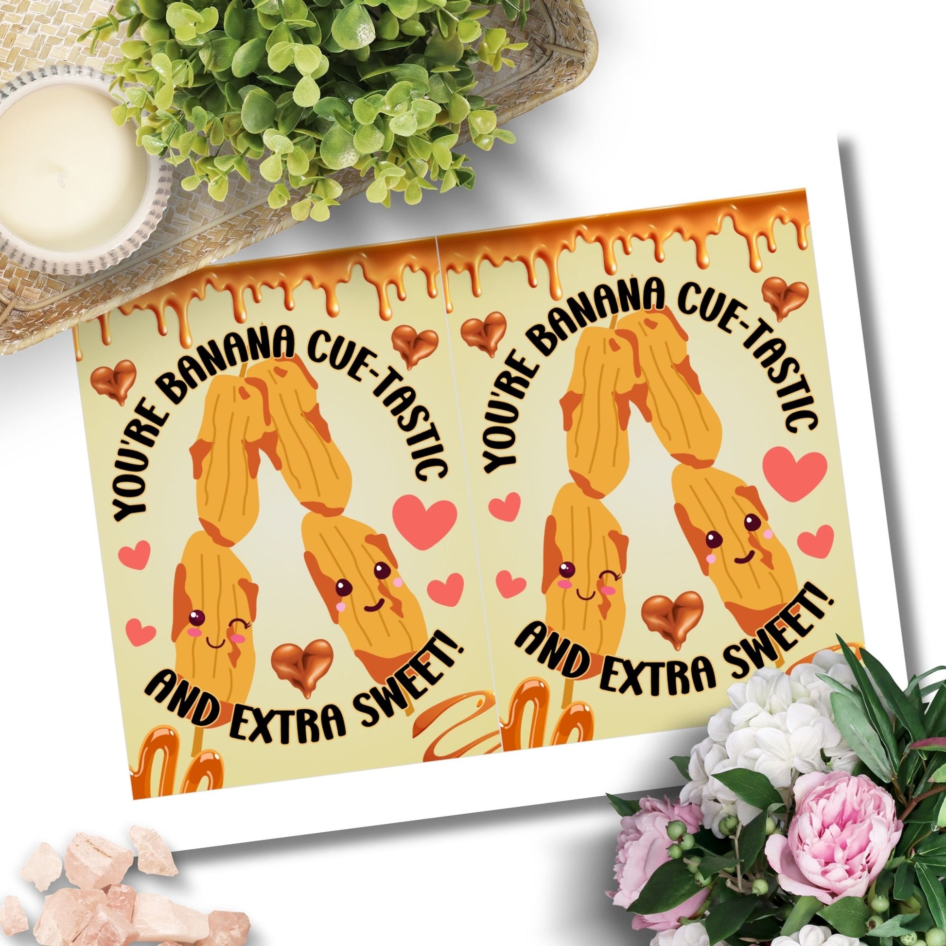 Printable Valentine’s Day card featuring the phrase “You're Bananacuetastic” with a Filipino Banana Cue-inspired design. Designed as a 5x7 PDF on an 8.5 x 11 sheet with two cards per page. A punny and heartfelt Valentine’s card for Filipino food lovers.