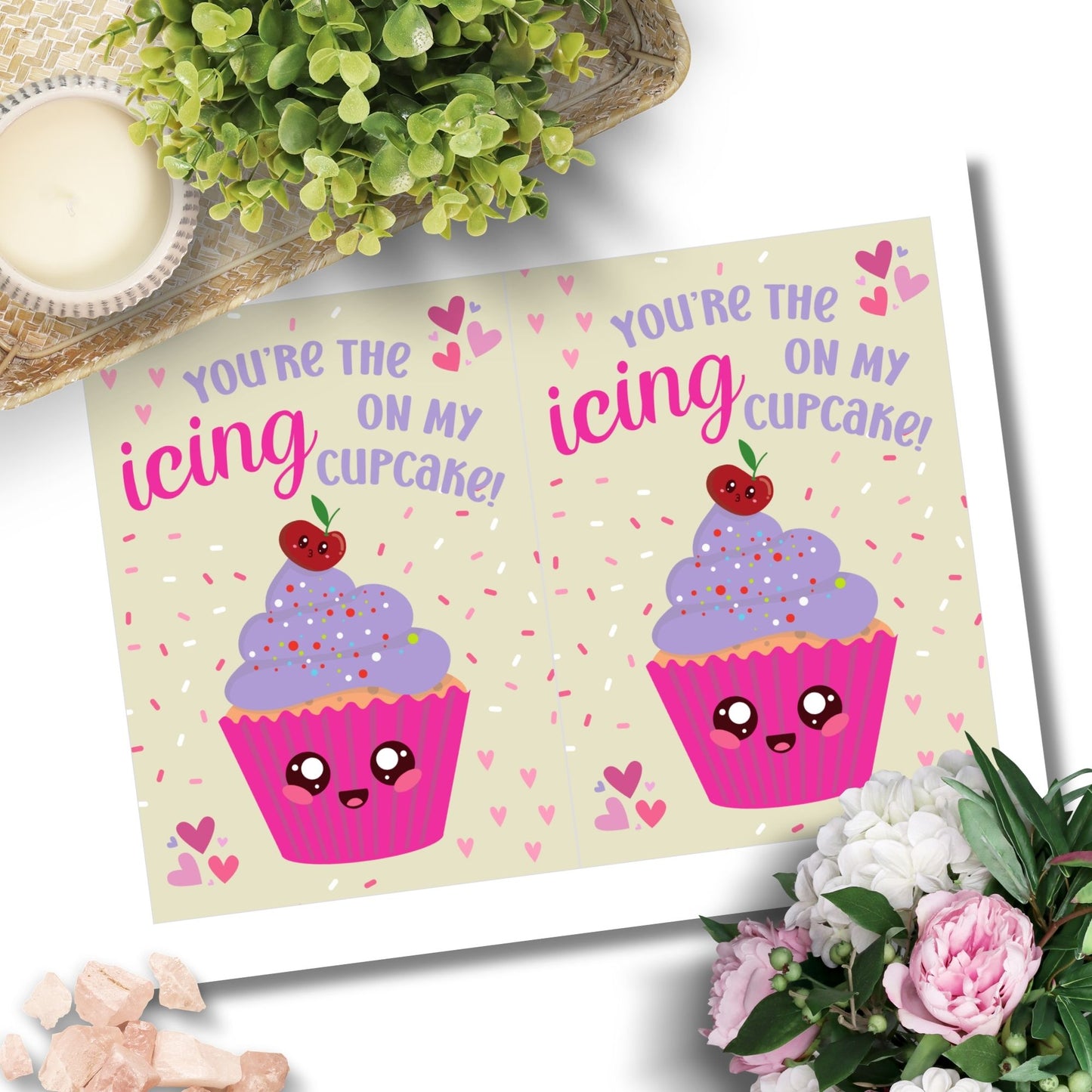 Printable Valentine’s Day card featuring the phrase “You’re the Icing on My Cupcake” with a cute cupcake design. Designed as a 5x7 PDF on an 8.5 x 11 sheet with two cards per page. A punny and sweet Valentine’s card for loved ones.