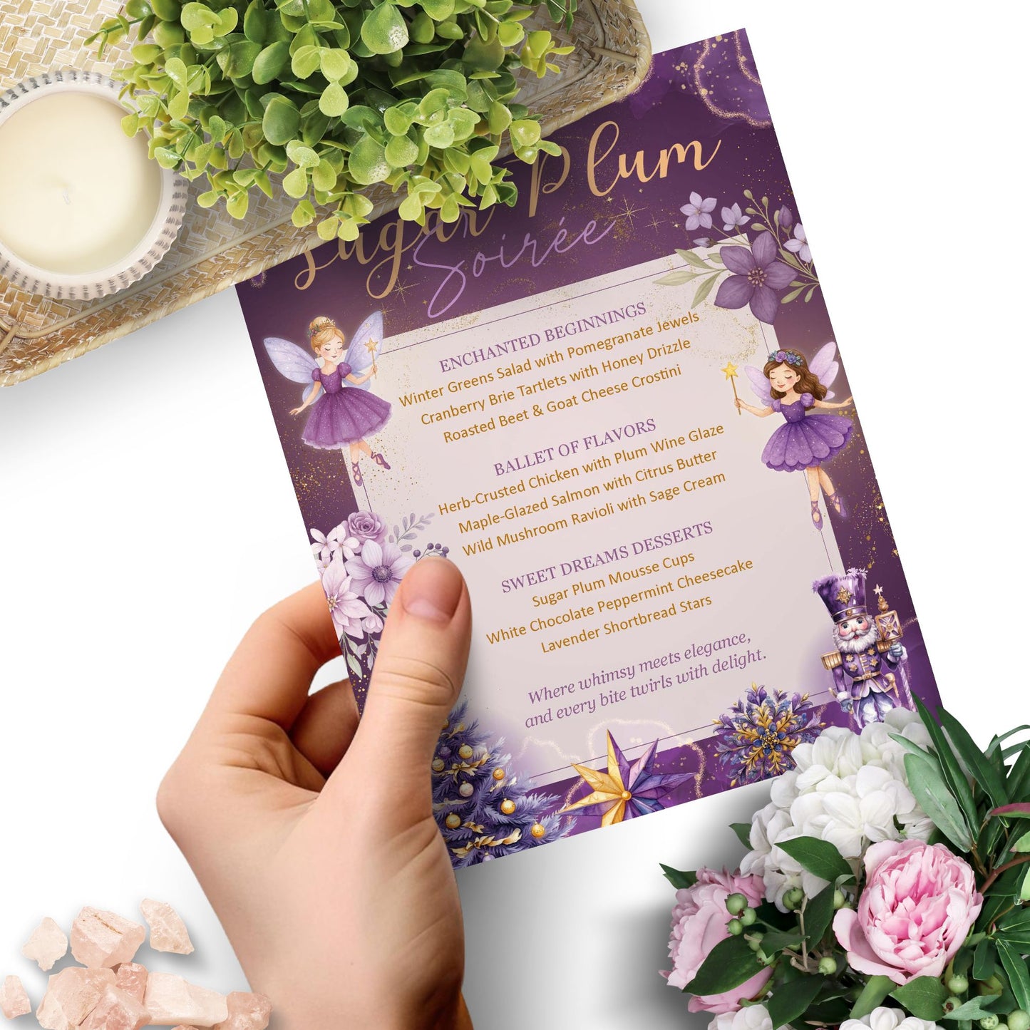 Hand holding a purple menu with fairy design, surrounded by flowers and a plant.
