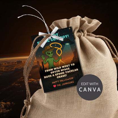 Alien holding a lasso on a Wild West Halloween gift tag with stars and space-themed elements, captioned "Howdy, Space Cowboy!"