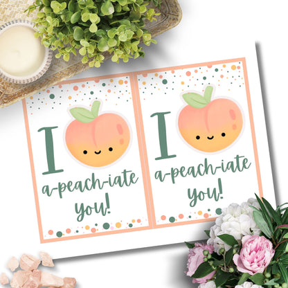 Printable Valentine’s Day Greeting Card featuring the phrase “I APEACHiate You” with a peach illustration. Designed as a 5x7 PDF on an 8.5 x 11 sheet with two cards per page. A fun and punny Valentine’s card for loved ones.