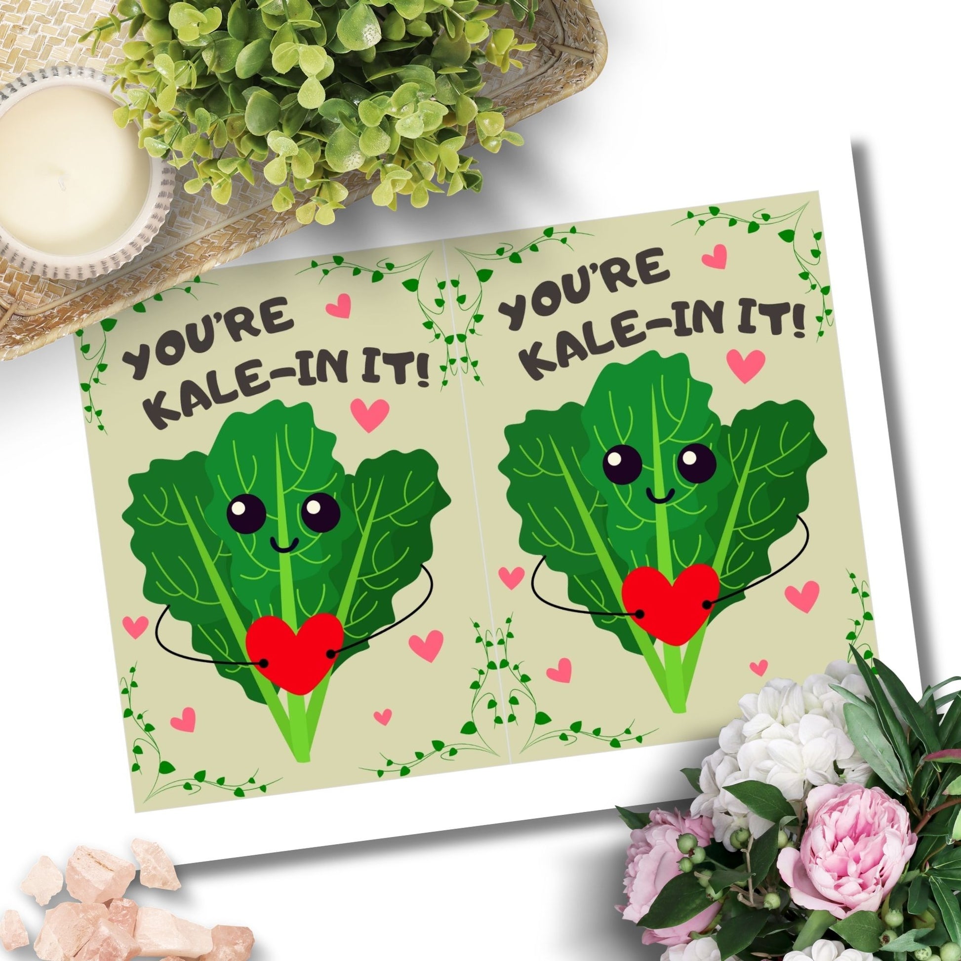 Printable Valentine’s Day Greeting Card featuring the phrase “You’re Kalein’ It” with a cute kale illustration. Designed as a 5x7 PDF on an 8.5 x 11 sheet with two cards per page. A punny and fresh Valentine’s card for loved ones.