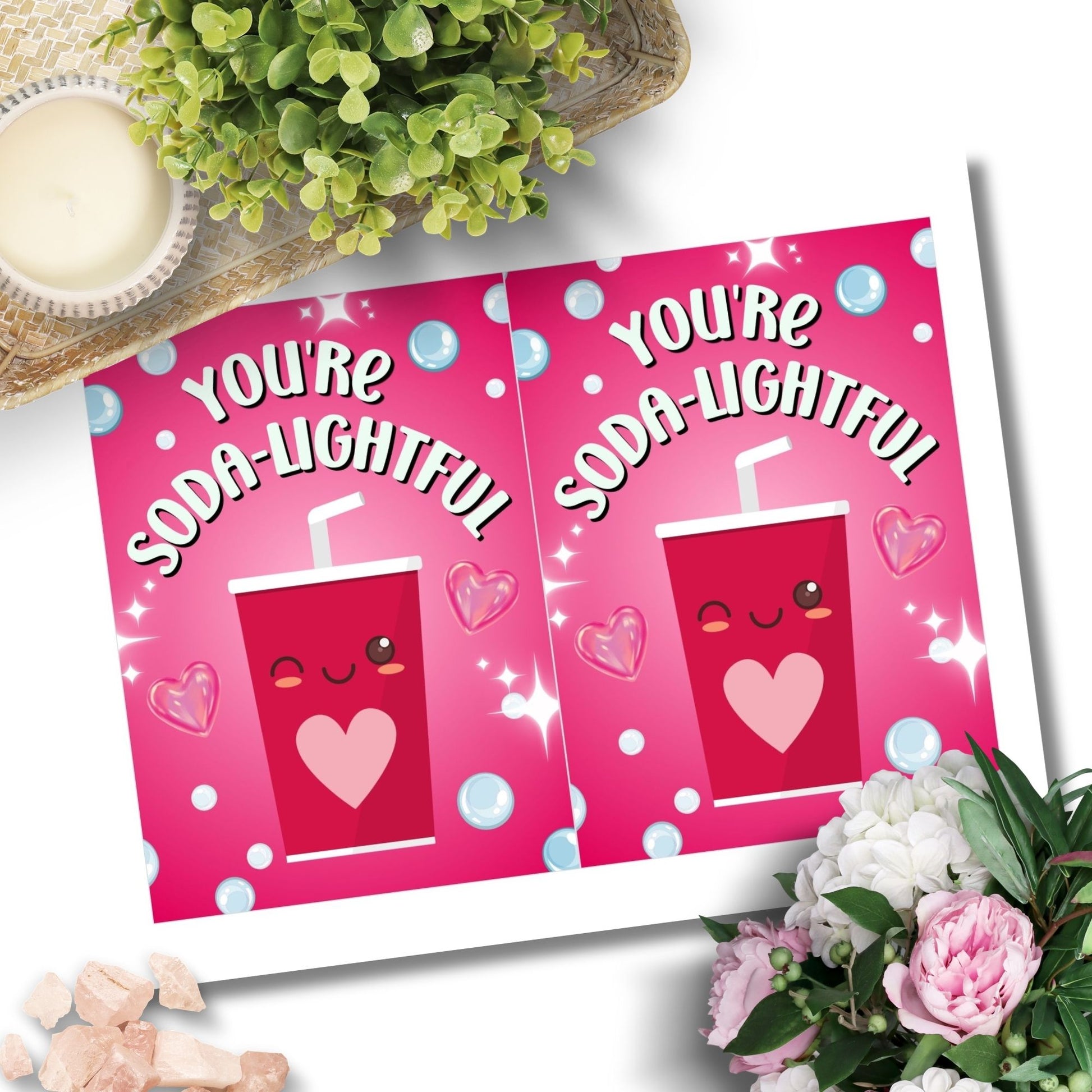 Printable Valentine’s Day Greeting Card featuring the phrase “You’re Soda-lightful” with a soda bottle illustration. Designed as a 5x7 PDF on an 8.5 x 11 sheet with two cards per page. A bubbly and pun-filled Valentine’s card for loved ones.