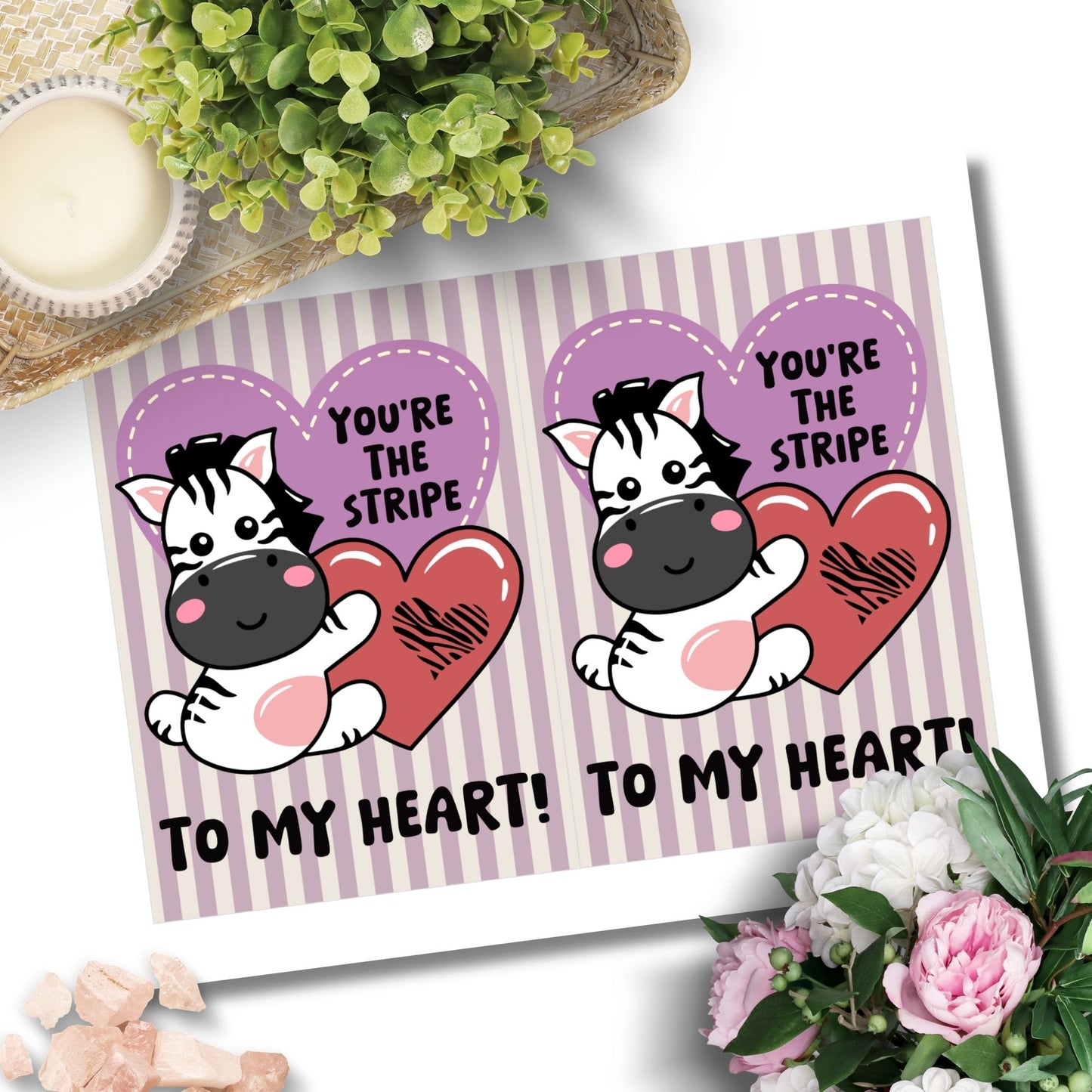 Printable Valentine’s Day Greeting Card featuring the phrase “You’re the Stripe to My Heart” with a zebra design. Designed as a 5x7 PDF on an 8.5 x 11 sheet with two cards per page. A cute and heartfelt Valentine’s card for zebra lovers.