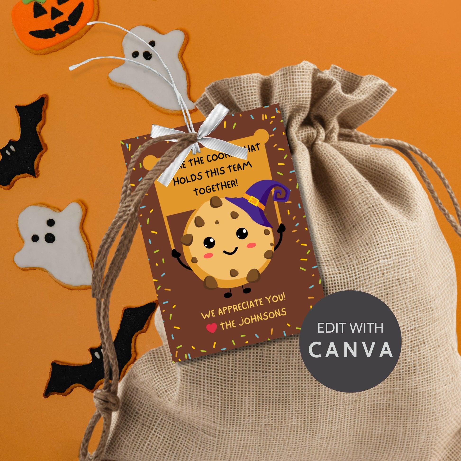 Halloween-themed printable gift tags featuring a cute cookie character in a witch's hat with a sign reading, "You're the cookie that holds this team together!" Tags are 2.5 x 3.5 inches, laid out 8 per sheet on a standard 8.5 x 11-inch page. Includes a printable PDF and a PDF with a link to an editable Canva template.