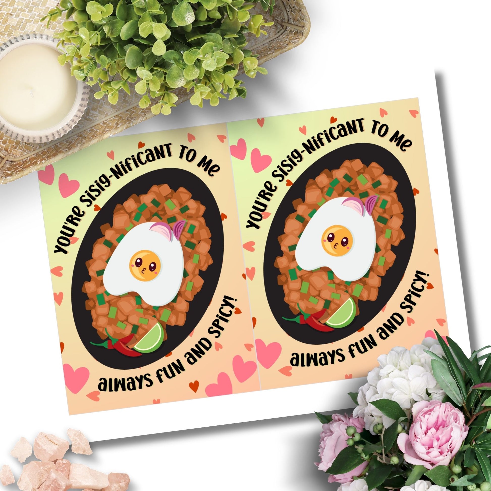 Printable Valentine’s Day card featuring the phrase “You're SiSignificant to Me” with a Filipino Sisig-inspired design. Designed as a 5x7 PDF on an 8.5 x 11 sheet with two cards per page. A punny and heartfelt Valentine’s card for Filipino food lovers.