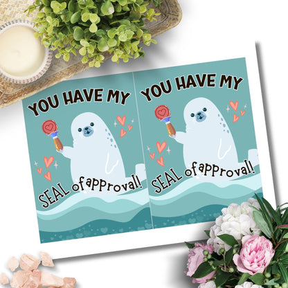 Printable Valentine’s Day Greeting Card featuring the phrase “You Have My Seal of Approval” with a seal theme. Designed as a 5x7 PDF on an 8.5 x 11 sheet with two cards per page. A cute and playful Valentine’s card for animal lovers.