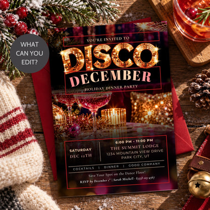 A festive disco December holiday dinner party invitation card layered over a red envelope, styled on a rustic wooden table with a knit sweater, pinecones, evergreen branches, and a glass of red drink.