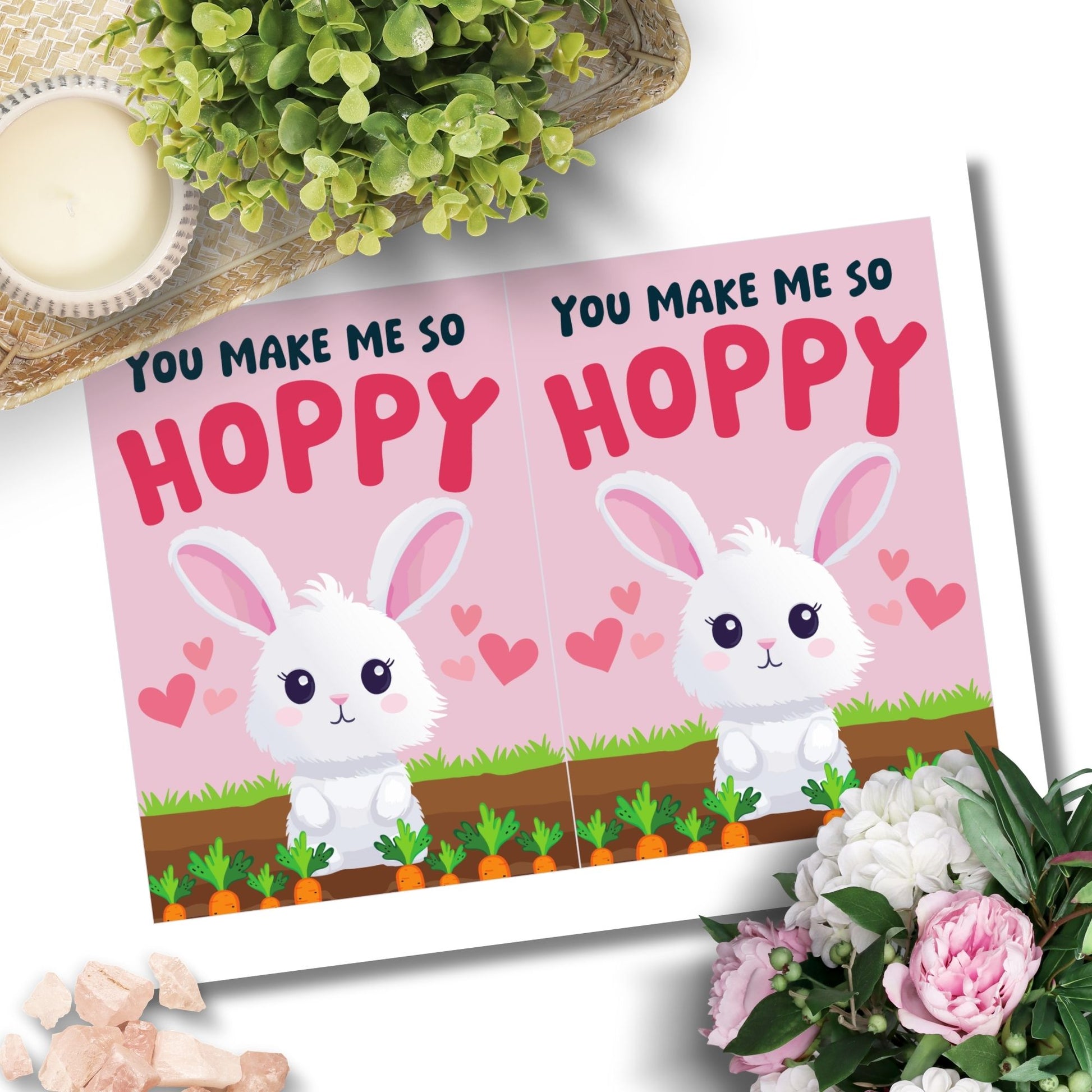 Printable Valentine’s Day Greeting Card featuring the pun “You Make Me So Hoppy.” Designed as a 5x7 PDF on an 8.5 x 11 sheet with two cards per page. A fun and cute Valentine’s card for bunny lovers.