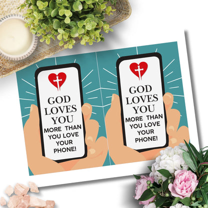 A Christian-themed printable Valentine’s Day card featuring the message “God Loves You More Than You Love Your Phone.” Available in 5x7 PDF format and an 8.5 x 11 printable sheet (2 cards per page). Perfect for youth groups, faith-based encouragement, and Christian gifts.