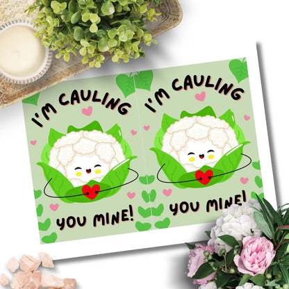 Printable Valentine’s Day Greeting Card featuring the phrase “I’m Cauling You Mine” with a cute cauliflower design. Designed as a 5x7 PDF on an 8.5 x 11 sheet with two cards per page. A fun and punny Valentine’s card for loved ones.