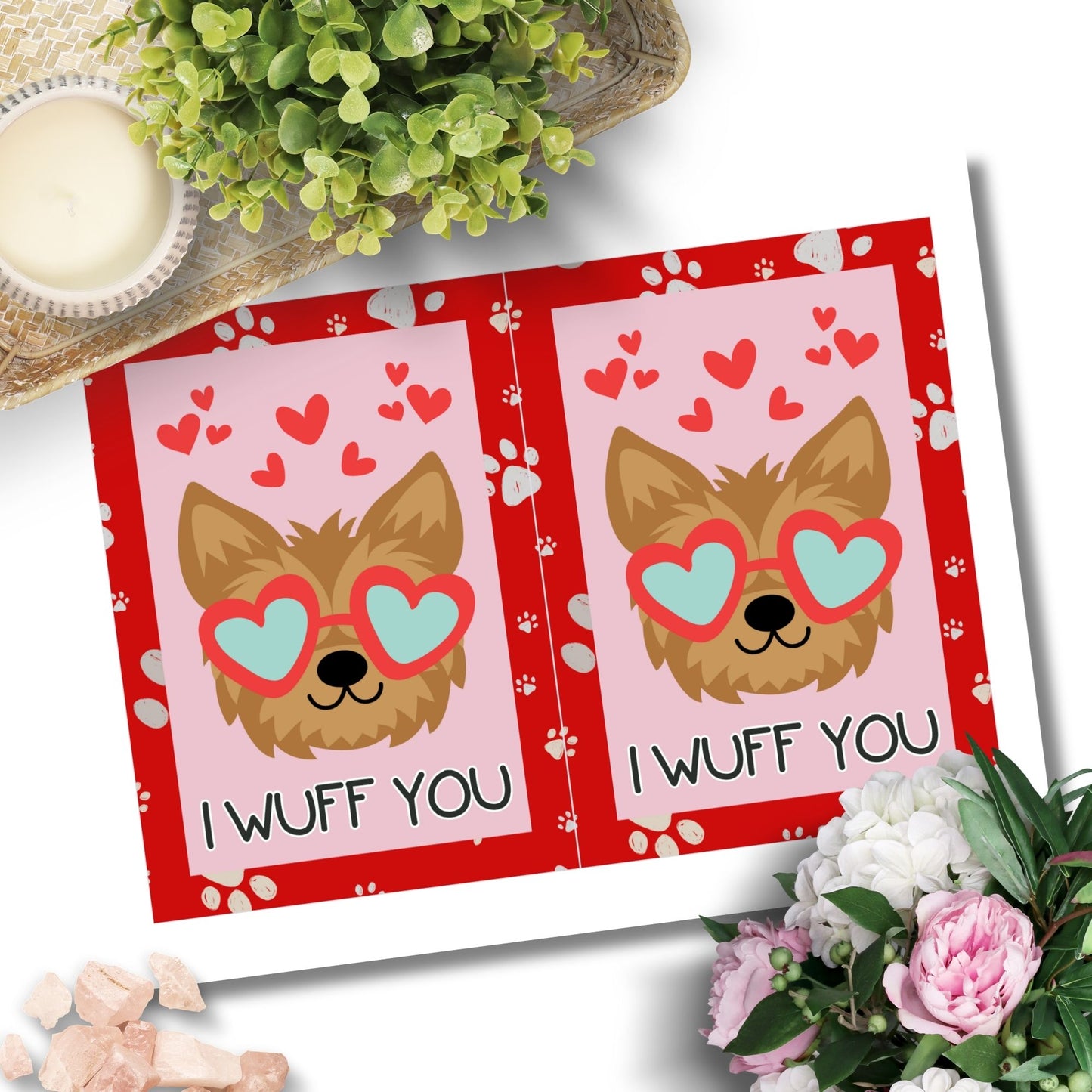 Printable Valentine’s Day Greeting Card featuring the pun “I Wuff You.” Designed as a 5x7 PDF on an 8.5 x 11 sheet with two cards per page. A cute and fun Valentine’s card for dog lovers.