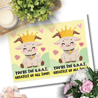 Printable Valentine’s Day Greeting Card featuring the phrase “You’re The GOAT” with a goat design. Designed as a 5x7 PDF on an 8.5 x 11 sheet with two cards per page. A fun and heartfelt Valentine’s card for loved ones.