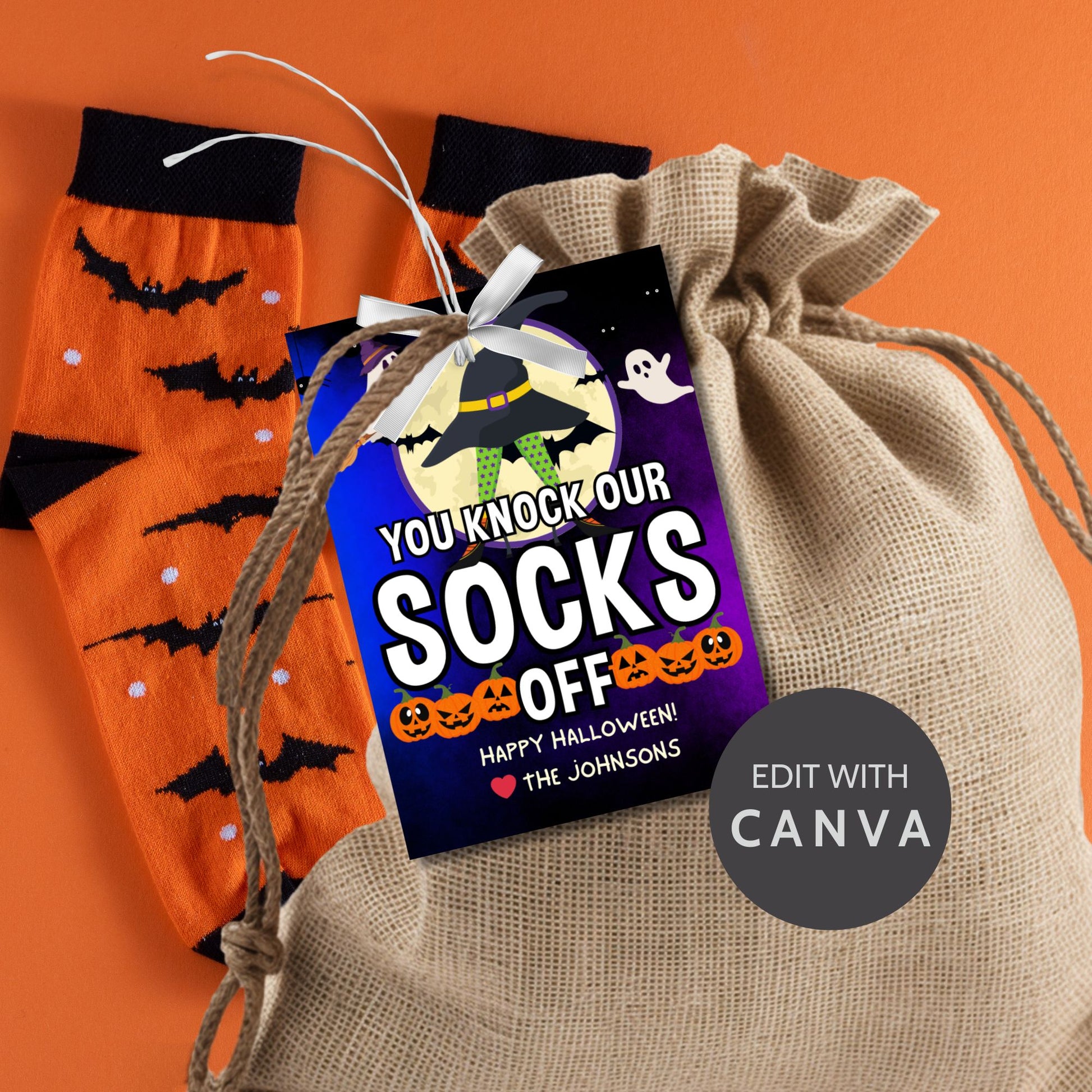 Halloween-themed printable gift tags with the message "You Knock Our Socks Off!" featuring a witch's hat, spooky ghosts, and jack-o'-lanterns, perfect for sock gifts. Tags are 2.5 x 3.5 inches, laid out 8 per sheet on a standard 8.5 x 11-inch page. Includes a printable PDF and a PDF with a link to an editable Canva template.